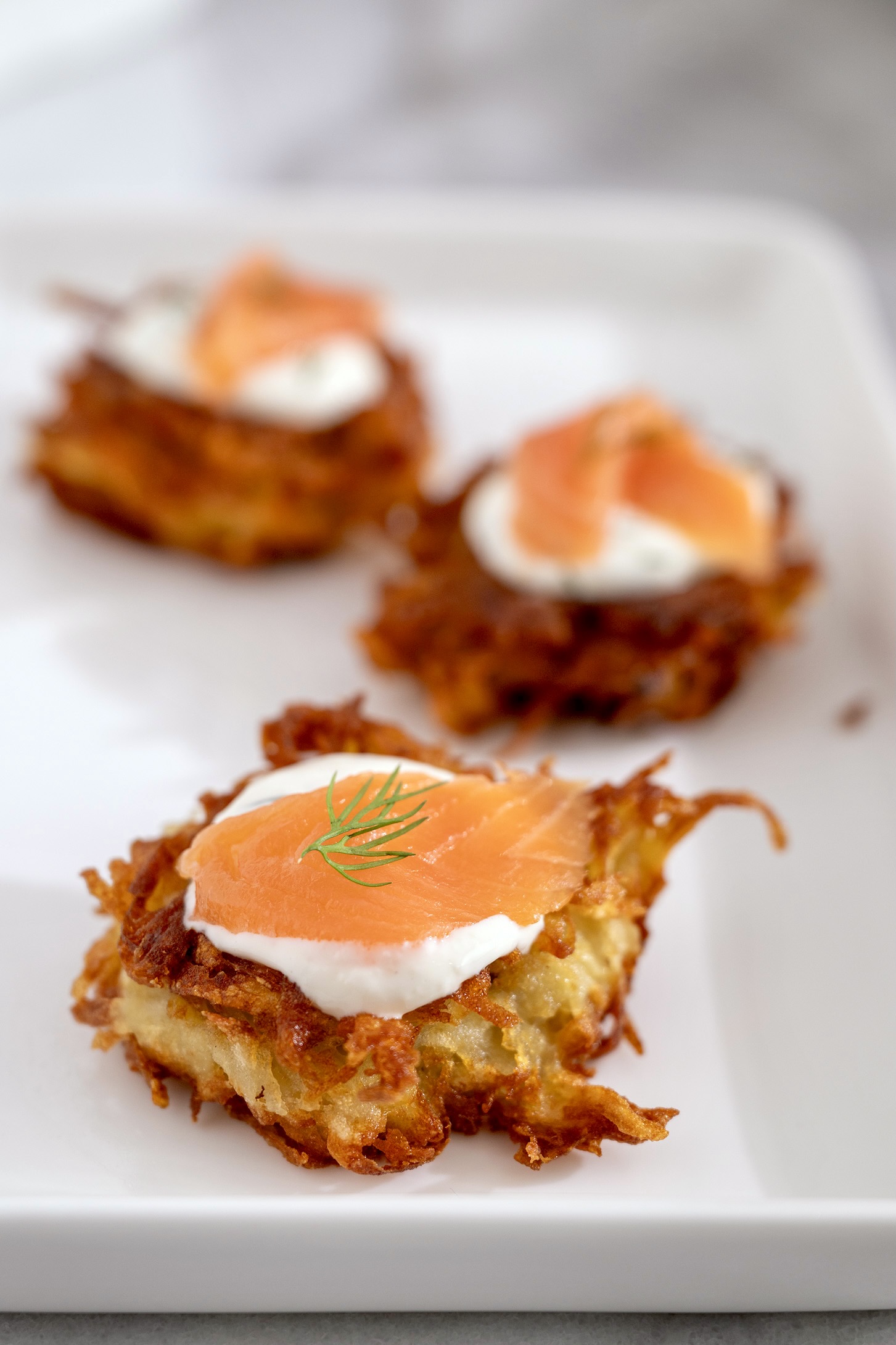 There's no draining or soaking in this recipe for the crispiest latkes, which come together quickly and easily, and make a crowd-pleasing appetizer or side. We love them topped with the horseradish dill sauce and smoked salmon!